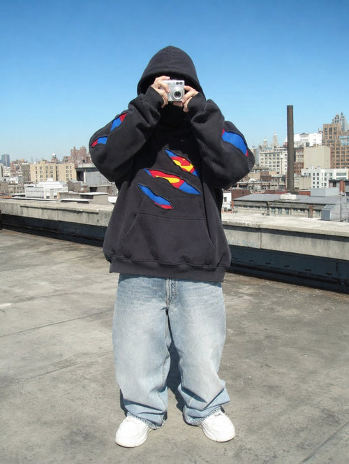 Daybreak Hoodie worn oversized on a rooftop
