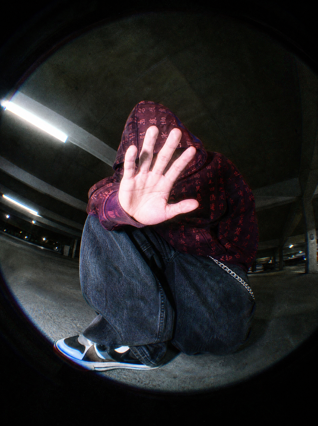 Art of War Camo Hoodie styled Y2K, fisheye hood-up shot